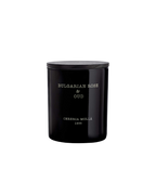 A black cylindrical bottle with a silver label that reads 'Bulgarian Rose Oud' and the brand name 'Cereia Molla' with a date '1999'.