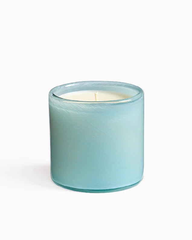 Blue glass candle on a white background